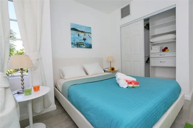 a bedroom with a bed and a dresser