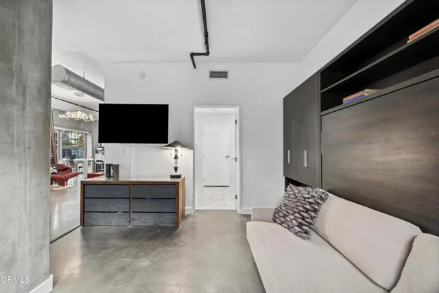 a bathroom with a shower and a sink