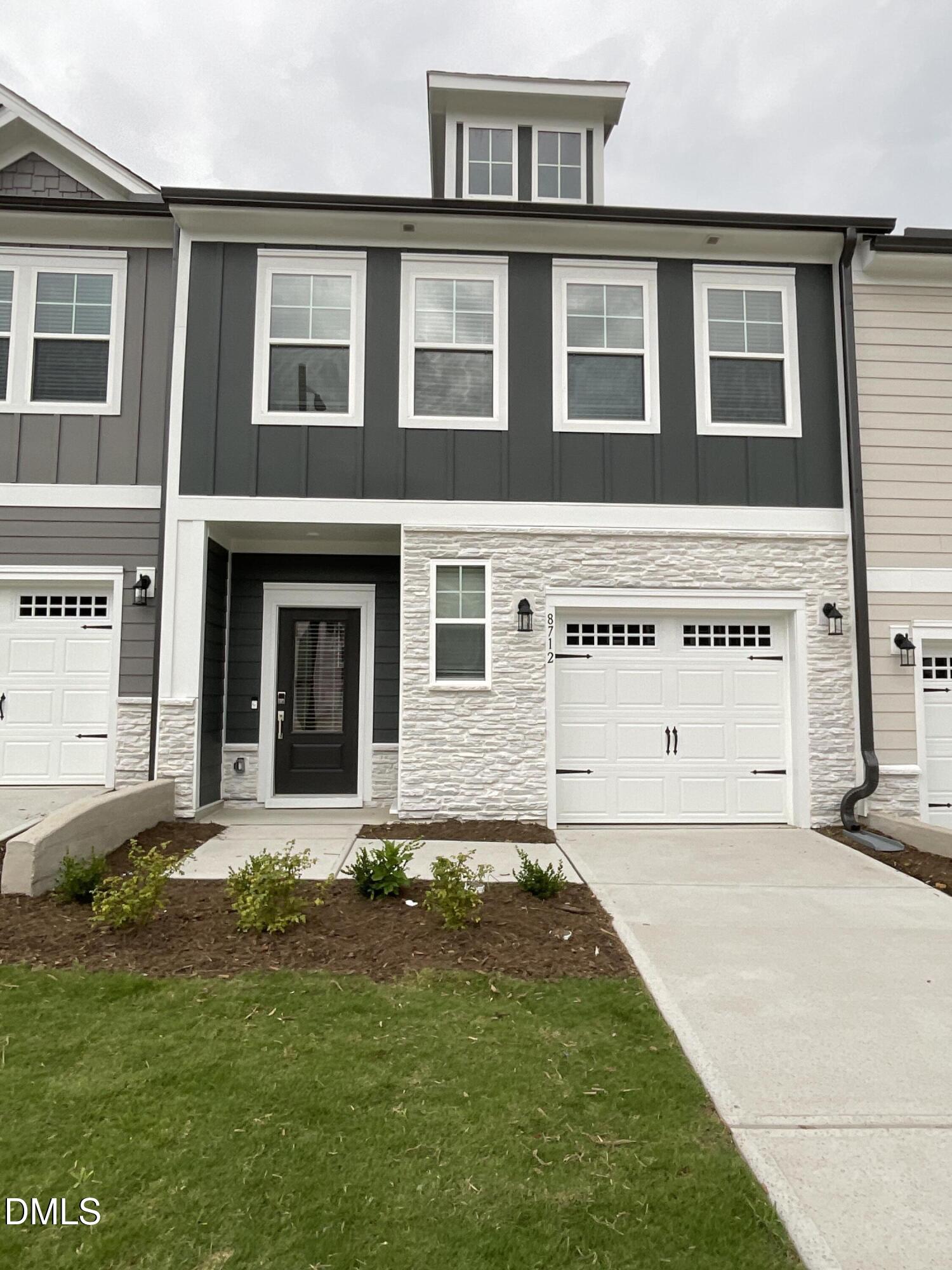 8712 Wardle Court Wake Forest, NC 27587 - Photo 1 of 33 a front view of a house with a yard