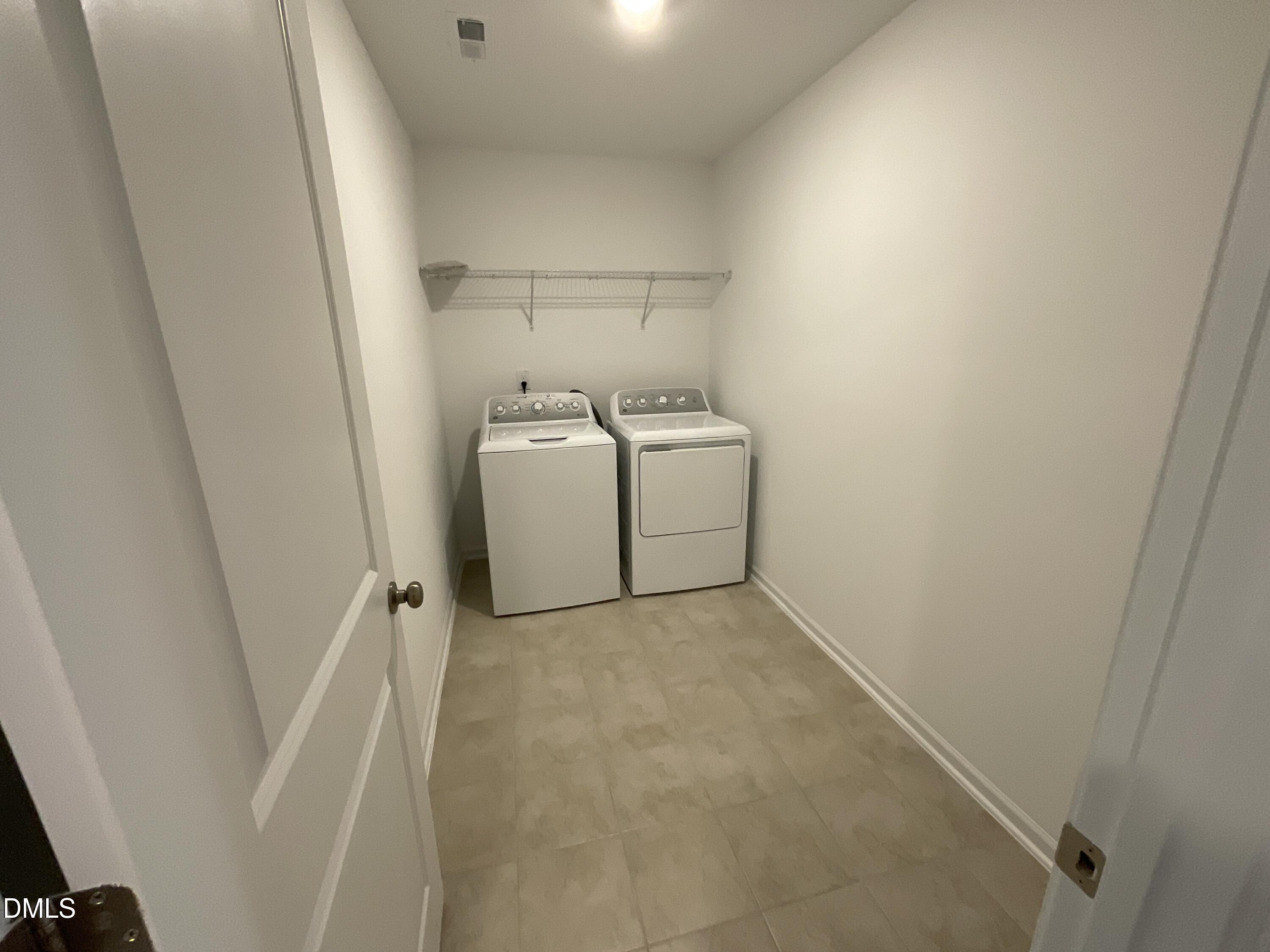 8712 Wardle Court Wake Forest, NC 27587 - Photo 16 of 33 a utility room with dryer and washer