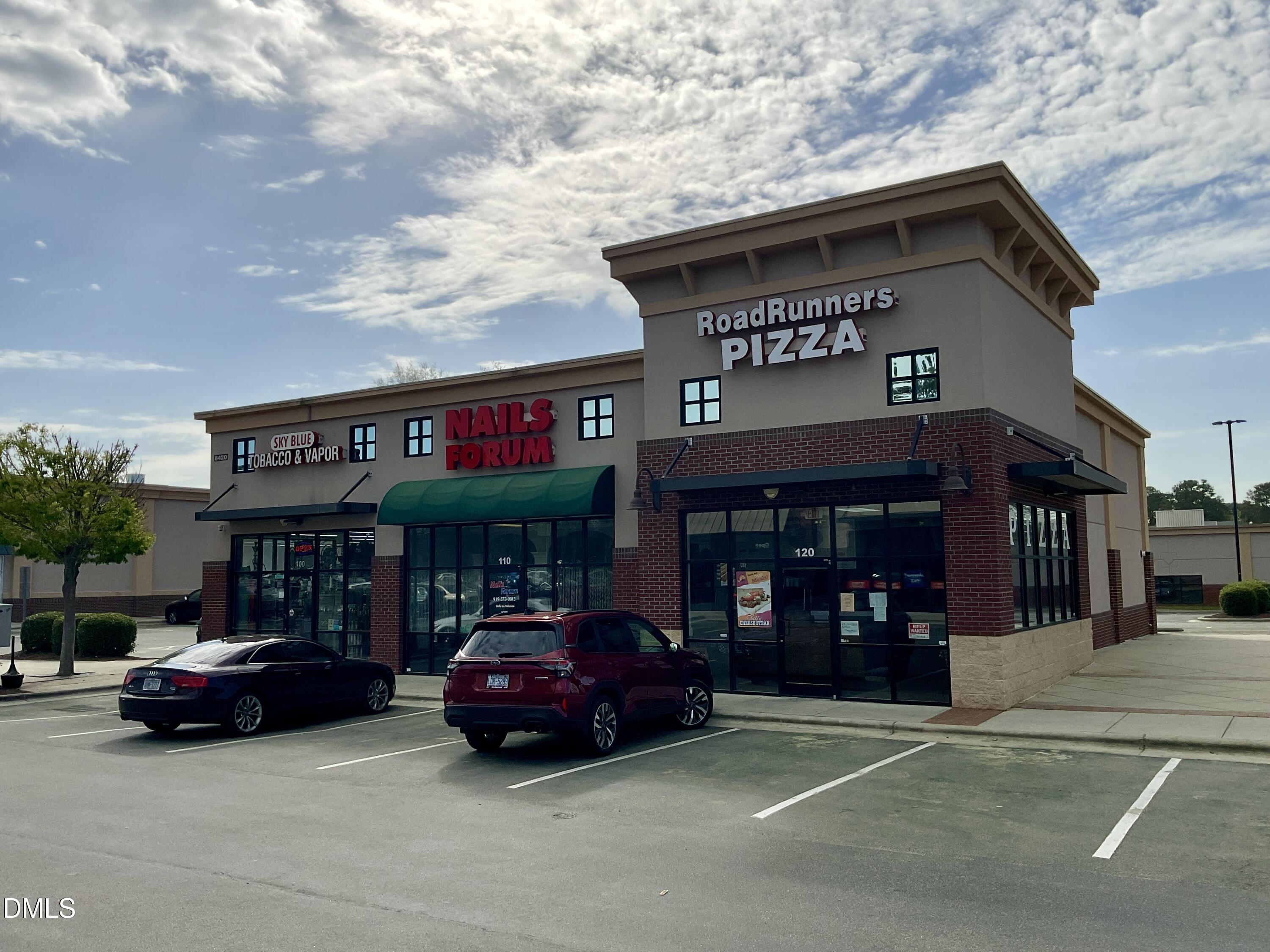 8712 Wardle Court Wake Forest, NC 27587 - Photo 21 of 33 a car parked in front of a store