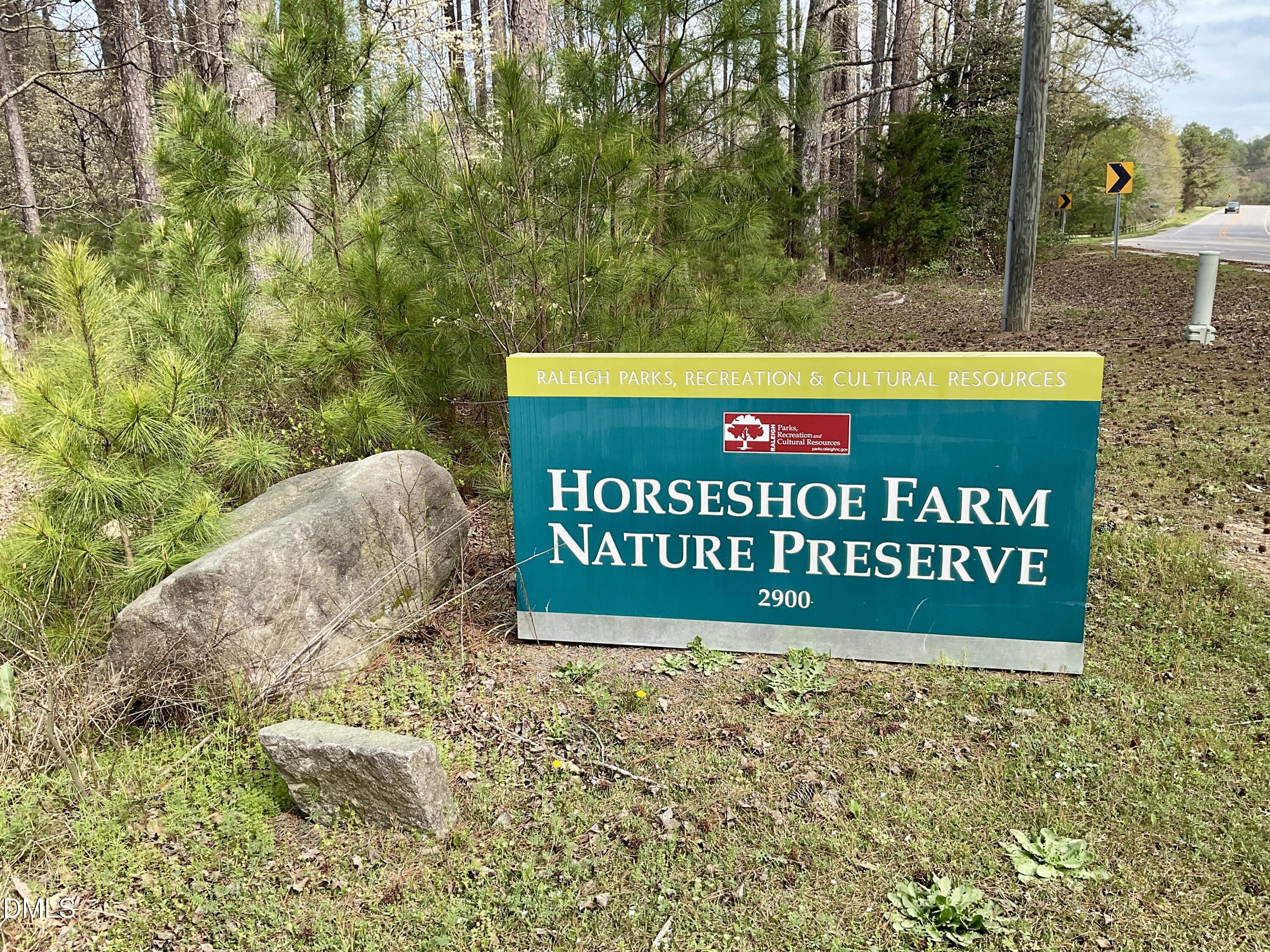 8712 Wardle Court Wake Forest, NC 27587 - Photo 30 of 33 a sign that is sitting on a wooden bench