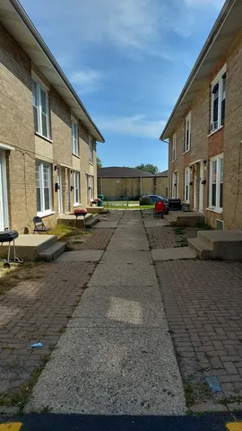 a view of car parked on the side of the road