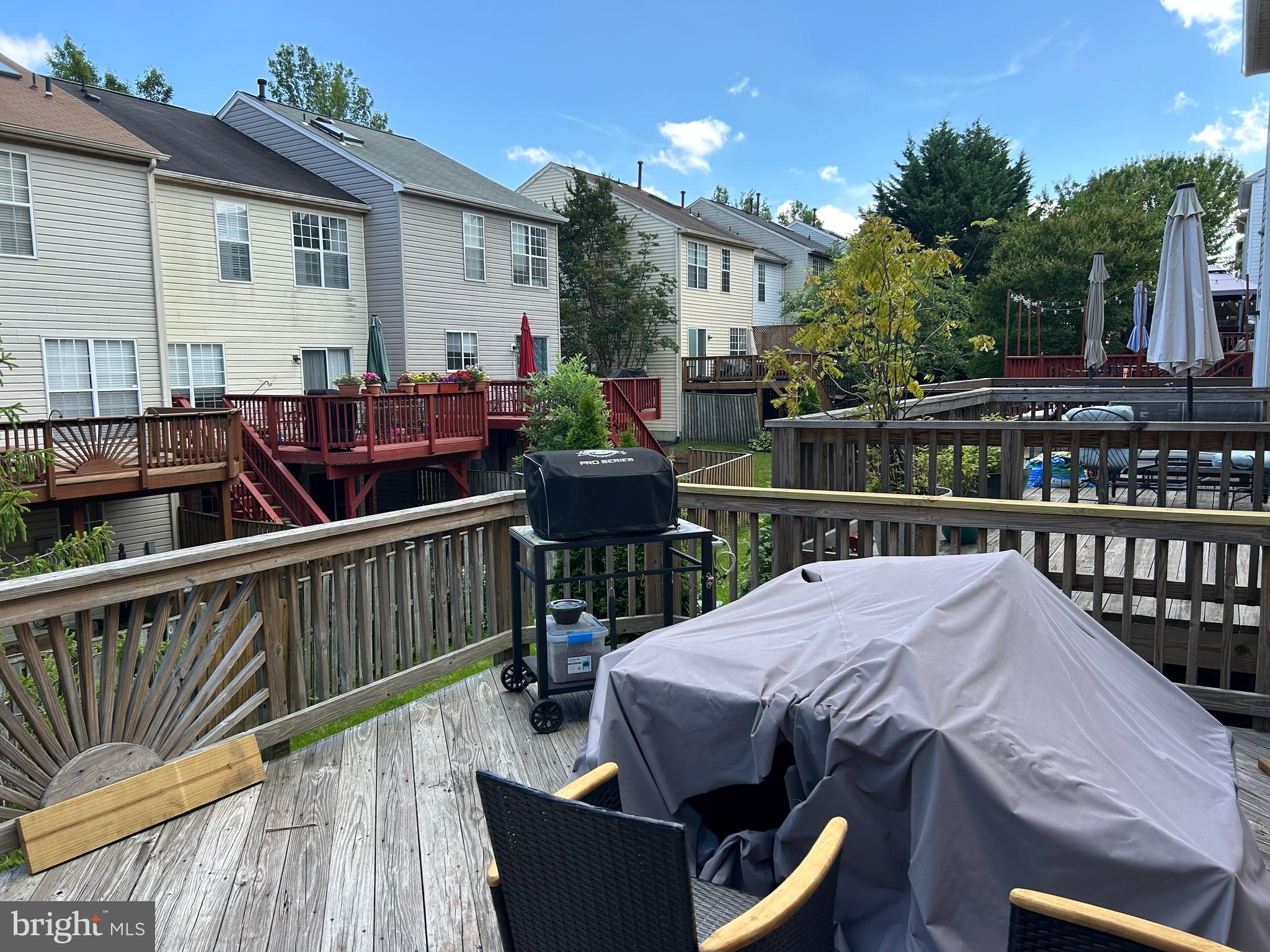 2304 Cold Meadow Way Silver Spring, MD 20906 - Photo 13 of 42 a view of a deck with furniture and a yard