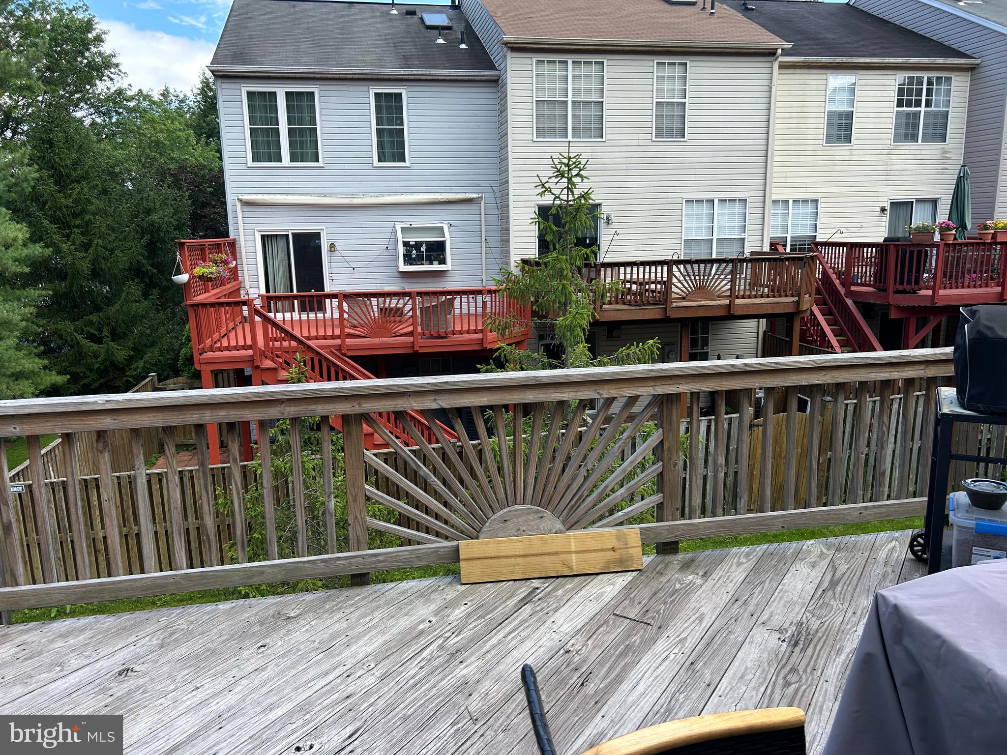 2304 Cold Meadow Way Silver Spring, MD 20906 - Photo 16 of 42 a view of a chair and tables on the deck