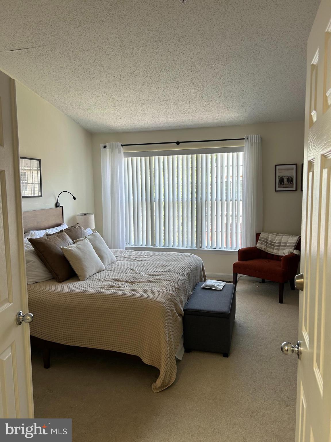 2304 Cold Meadow Way Silver Spring, MD 20906 - Photo 27 of 42 a bedroom with a bed and a couch