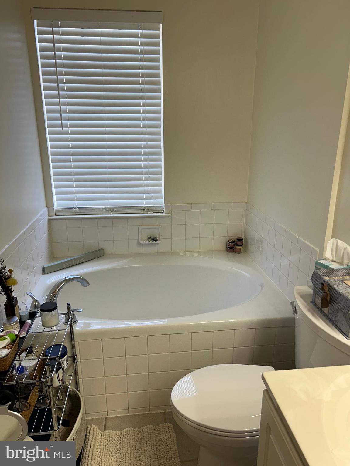 2304 Cold Meadow Way Silver Spring, MD 20906 - Photo 30 of 42 a bathroom with a toilet a sink and a bathtub