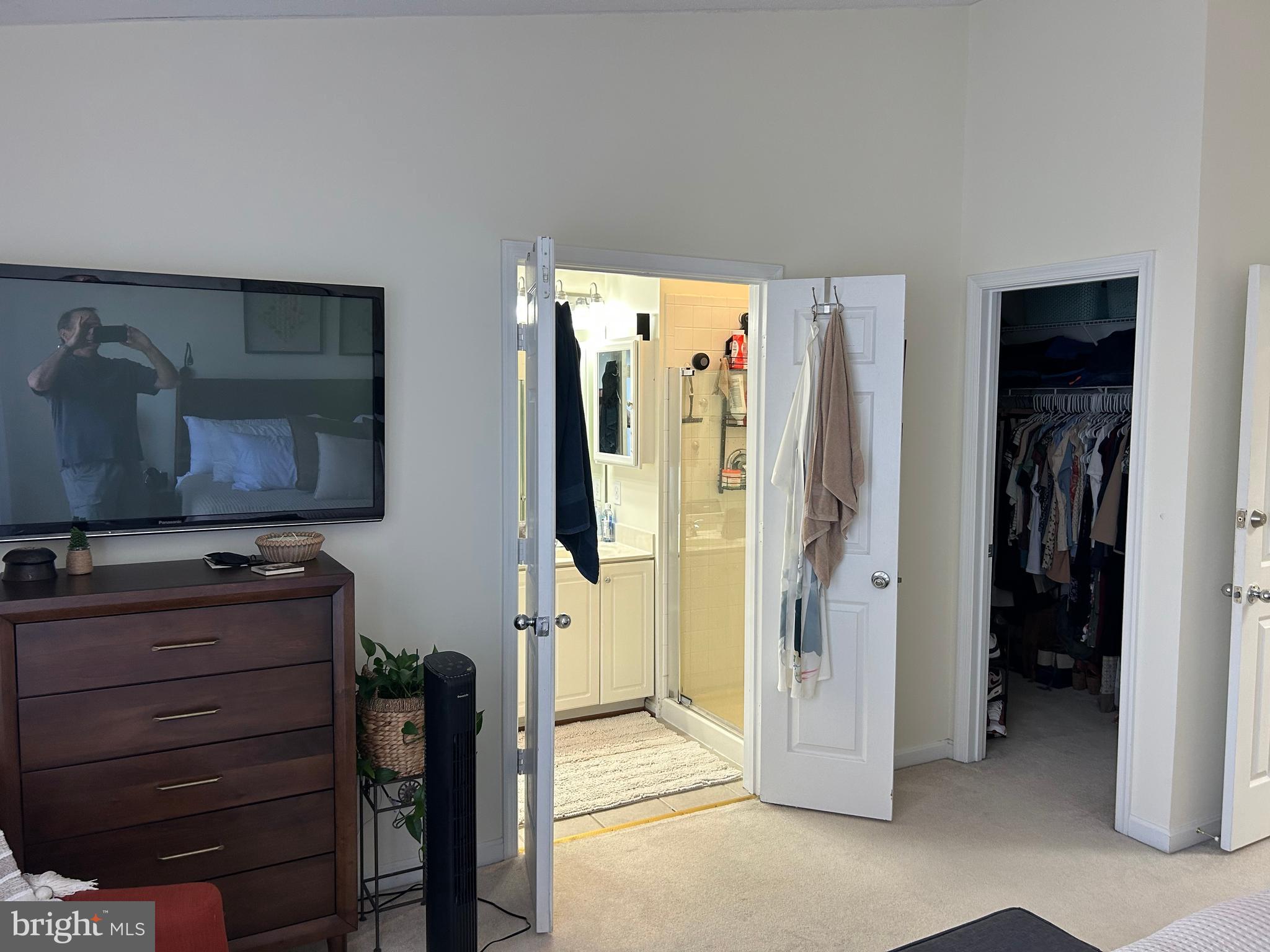 2304 Cold Meadow Way Silver Spring, MD 20906 - Photo 32 of 42 a view of walk in closet with clothes and shoes