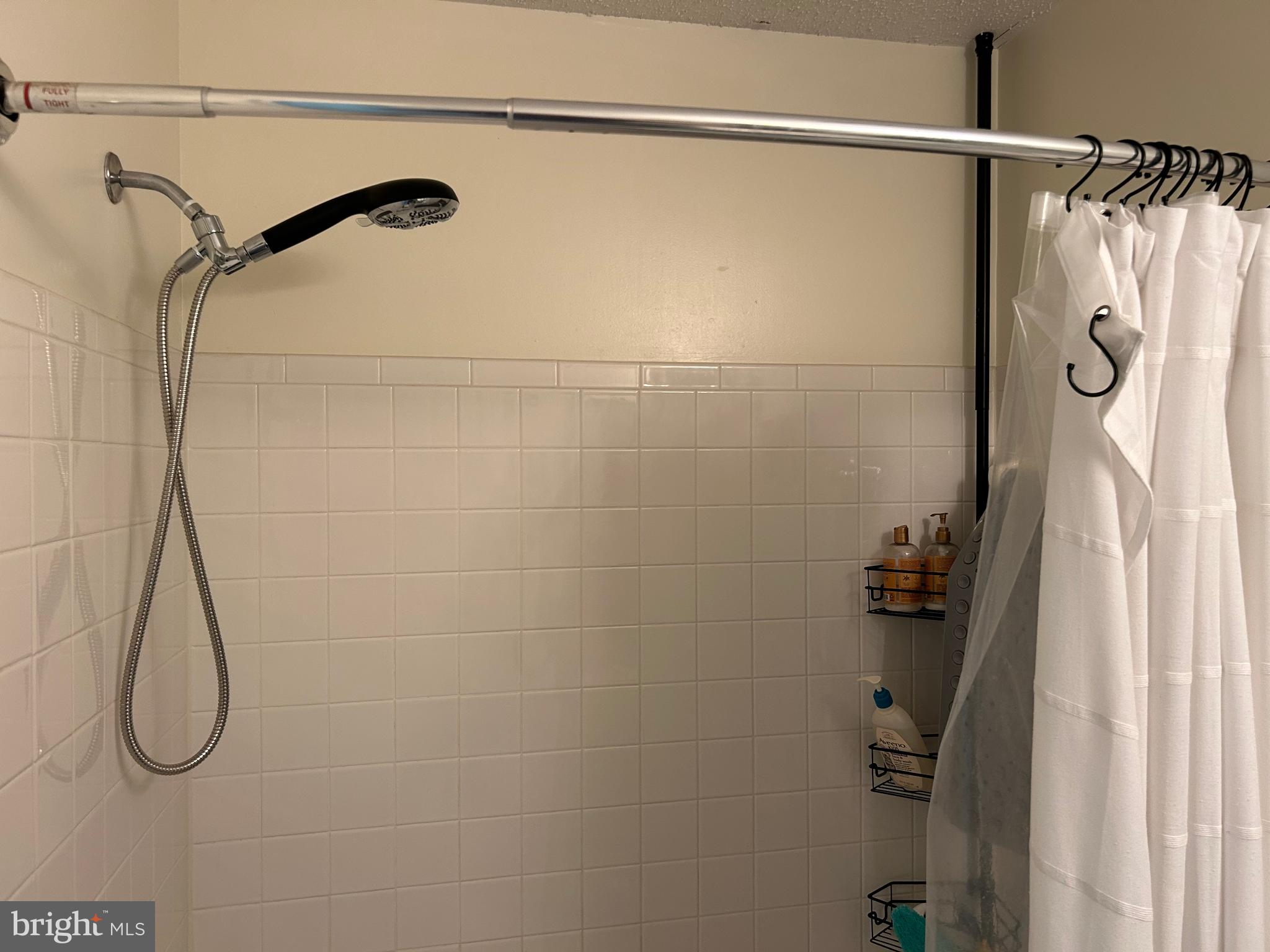 2304 Cold Meadow Way Silver Spring, MD 20906 - Photo 34 of 42 a bathroom with a shower and a shower head