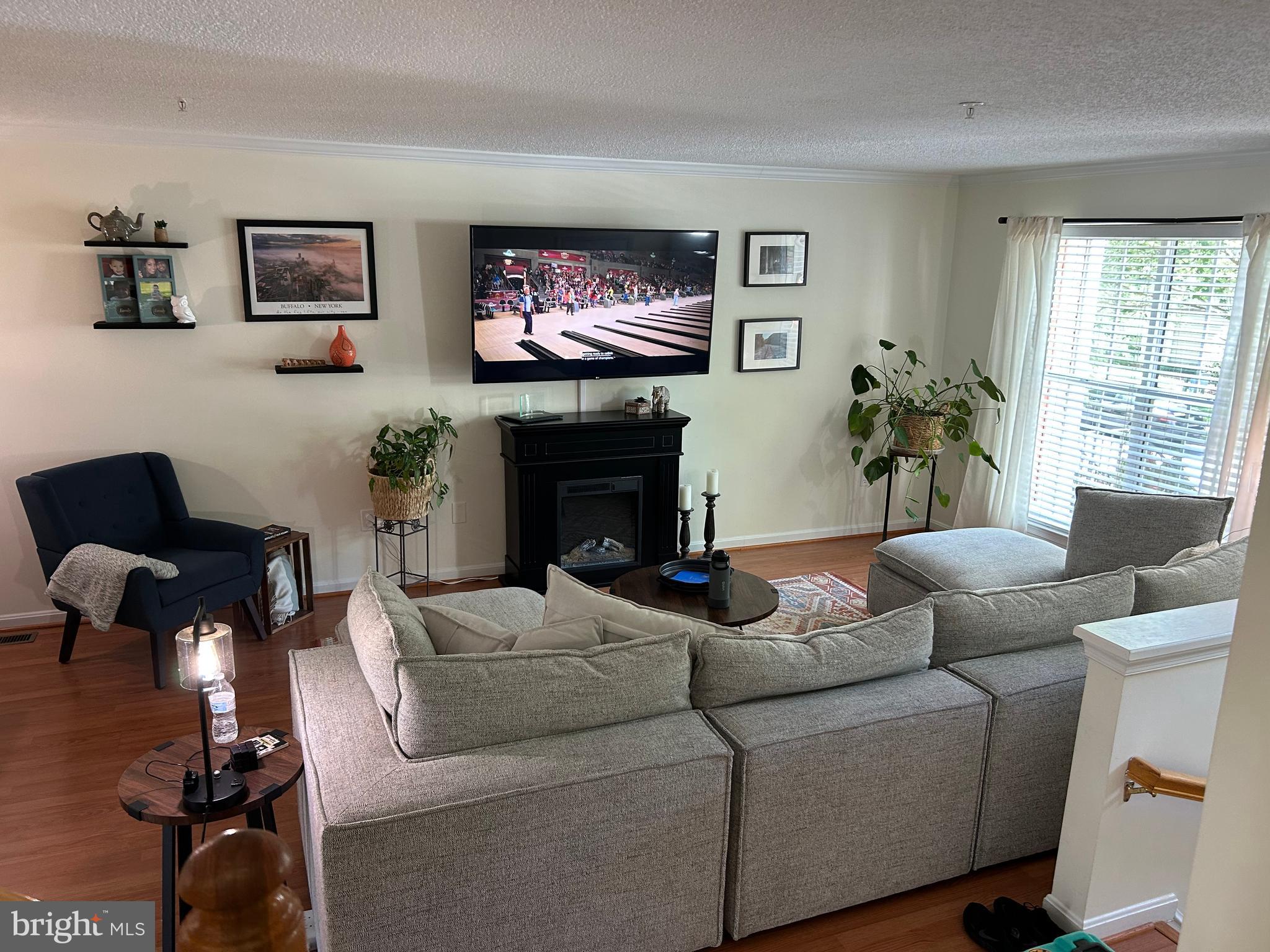 2304 Cold Meadow Way Silver Spring, MD 20906 - Photo 39 of 42 a living room with furniture and a flat screen tv