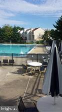 2304 Cold Meadow Way Silver Spring, MD 20906 - Photo 41 of 42 a view of a swimming pool with a lake view
