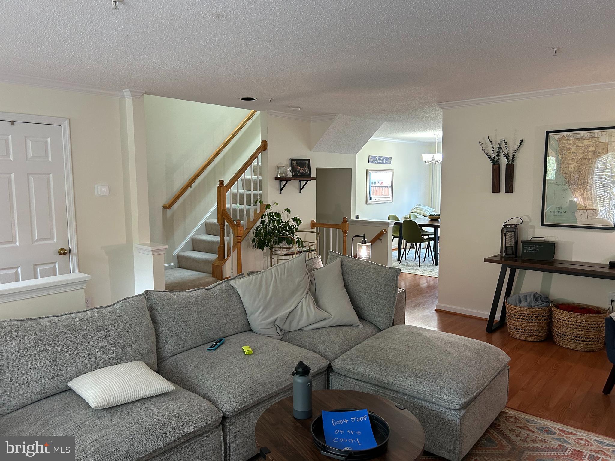 2304 Cold Meadow Way Silver Spring, MD 20906 - Photo 6 of 42 a living room with furniture and a wooden floor