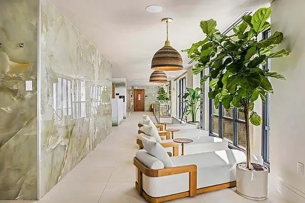 a view of a living room and entryway