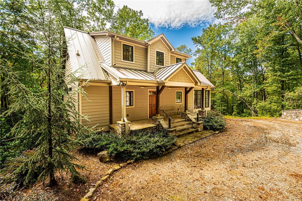 1038 Wilkins Cove Road Suches, GA 30572 - Photo 1 of 89 a front view of a house with a yard