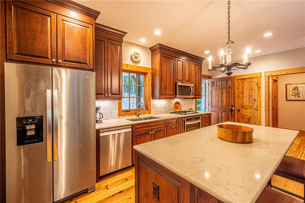 1038 Wilkins Cove Road Suches, GA 30572 - Photo 13 of 89 a kitchen with stainless steel appliances a refrigerator and a sink