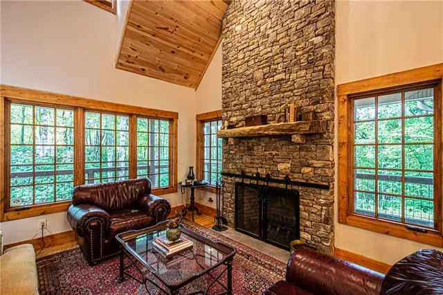 a bedroom with a bed window and a ceiling fan