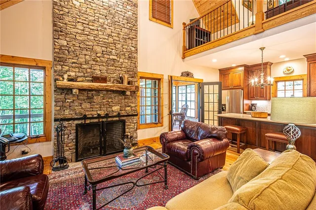 a bathroom with a granite countertop shower and a sink