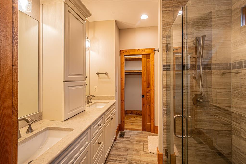 1038 Wilkins Cove Road Suches, GA 30572 - Photo 28 of 89 a bathroom with a granite countertop shower and a sink