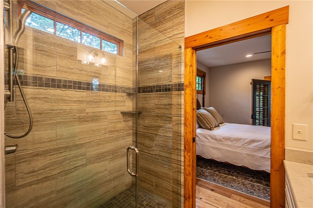 1038 Wilkins Cove Road Suches, GA 30572 - Photo 31 of 89 a bathroom with a sink and a shower
