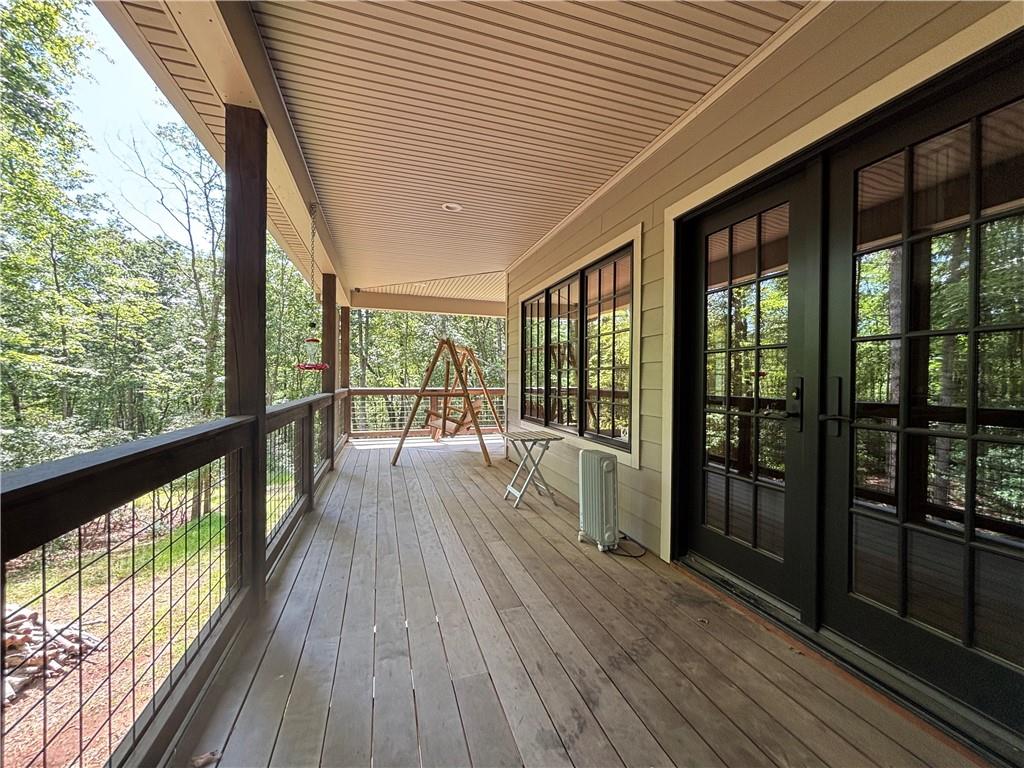 1038 Wilkins Cove Road Suches, GA 30572 - Photo 36 of 89 a view of a balcony with wooden floor