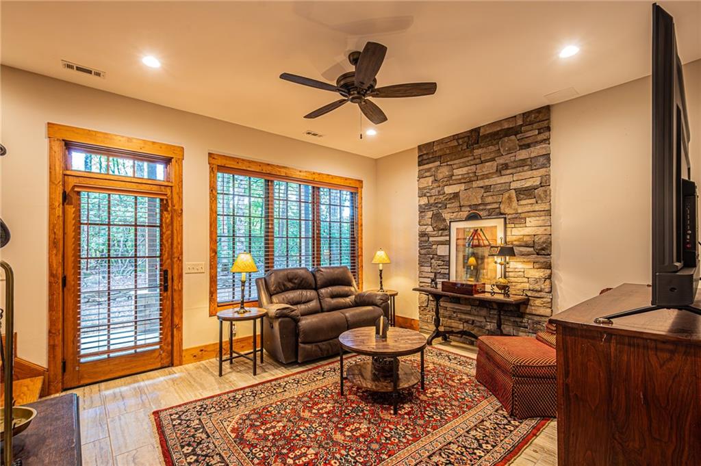 1038 Wilkins Cove Road Suches, GA 30572 - Photo 47 of 89 a living room with furniture a rug and a large window
