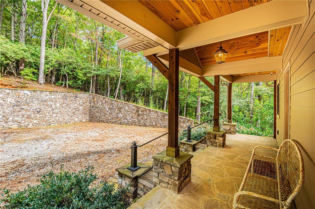 1038 Wilkins Cove Road Suches, GA 30572 - Photo 5 of 89 a view of a patio with a table chairs and wooden fence