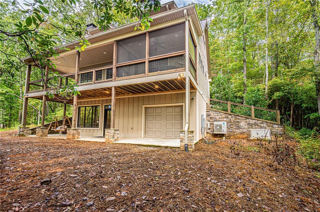 1038 Wilkins Cove Road Suches, GA 30572 - Photo 73 of 89 a front view of a house with a garden