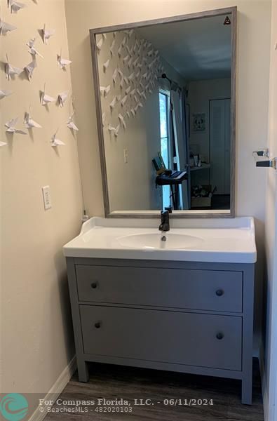 Brandywine Condominiums Gainesville, FL 32608 - Photo 13 of 18 a bathroom with a sink vanity and a mirror