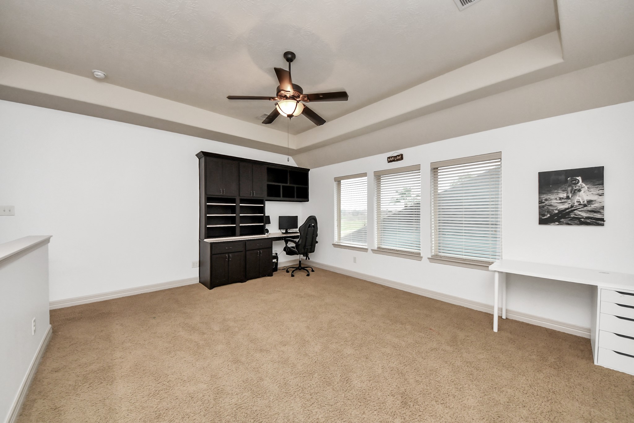 10410 Mossback Pine Road Katy, TX 77494 - Photo 19 of 34 a view of a livingroom with a flat screen tv