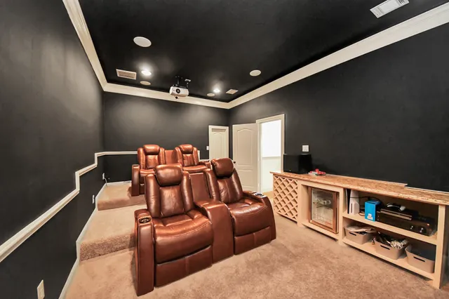 a bedroom with a bed a chair and a large closet