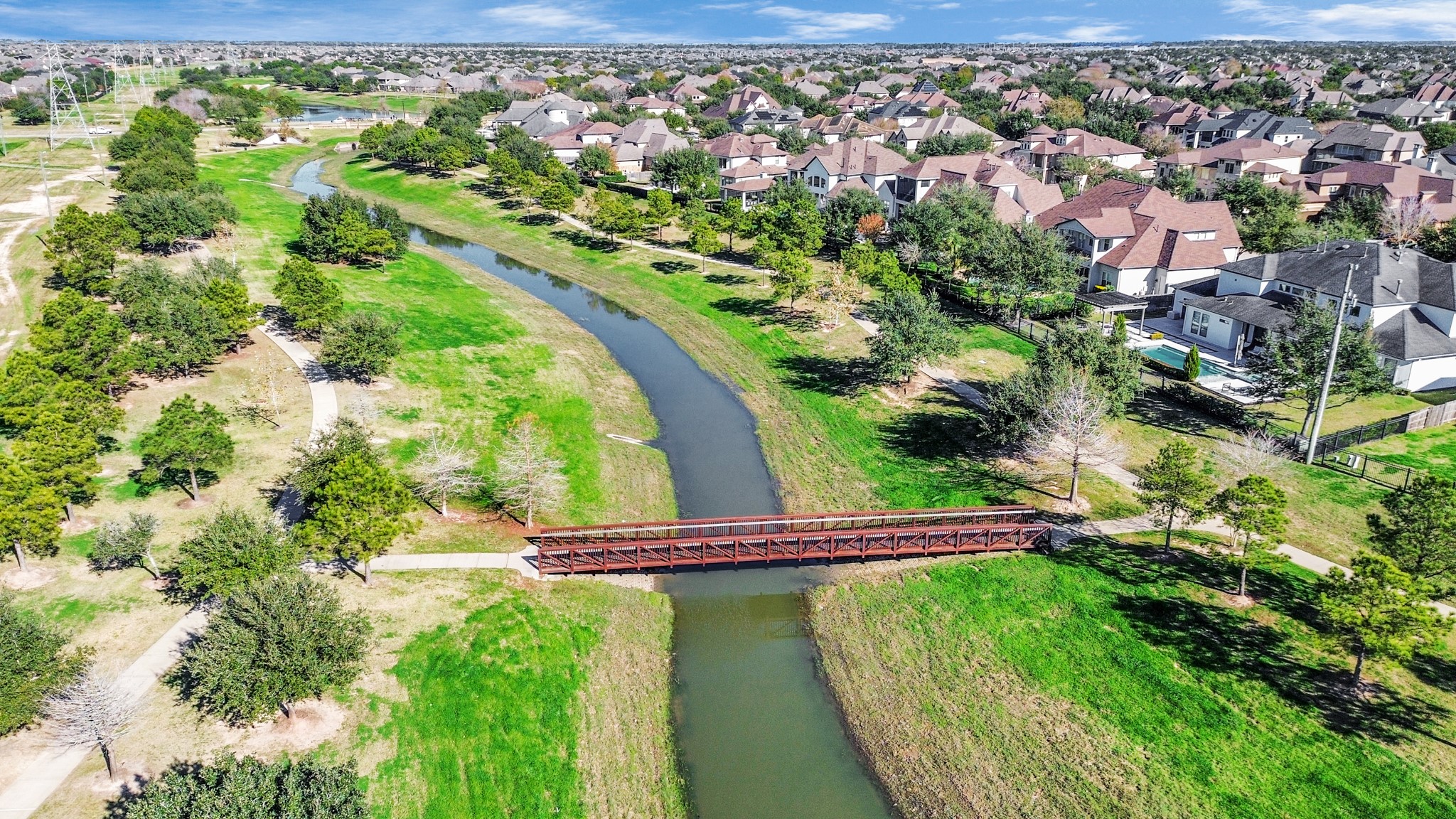 10410 Mossback Pine Road Katy, TX 77494 - Photo 33 of 34 a view of a swimming pool with a yard