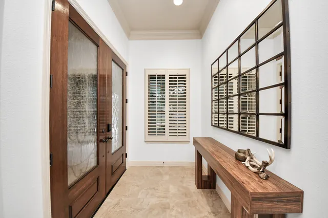 a bathroom with a bathtub a sink and a window