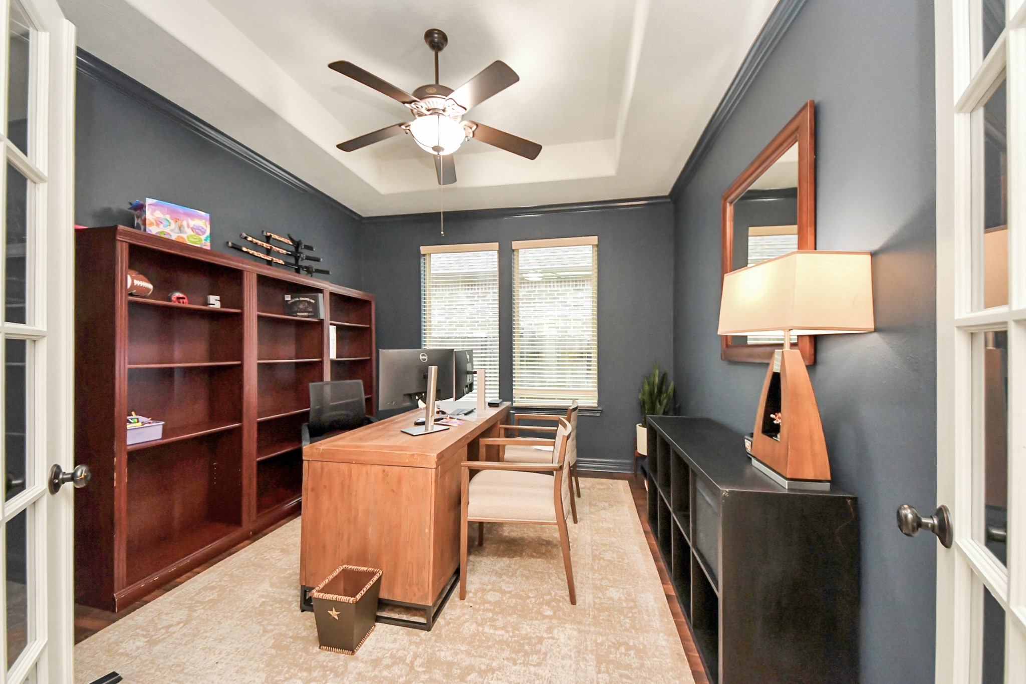 10410 Mossback Pine Road Katy, TX 77494 - Photo 7 of 34 a view of a workspace with furniture and a window