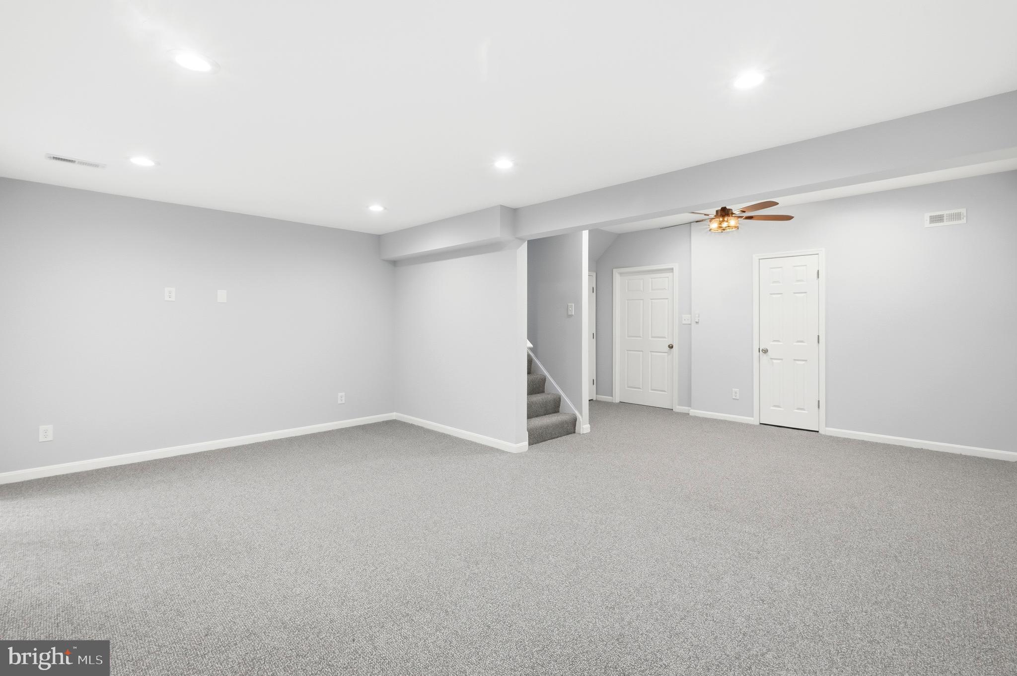 15012 Wheatland Place Laurel, MD 20707 - Photo 19 of 24 an empty room with a ceiling fan and window