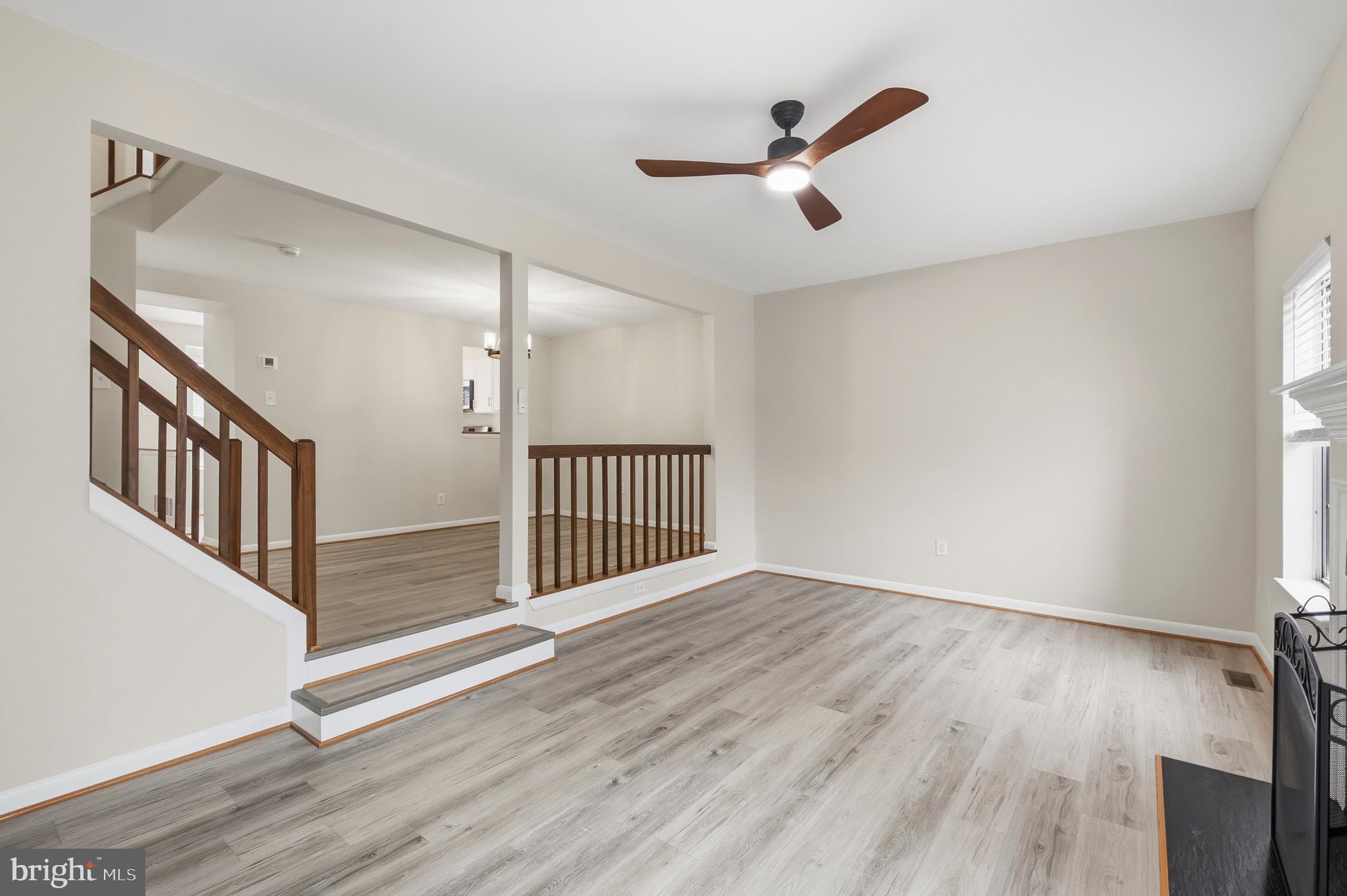 15012 Wheatland Place Laurel, MD 20707 - Photo 7 of 24 wooden floor in an empty room with a window