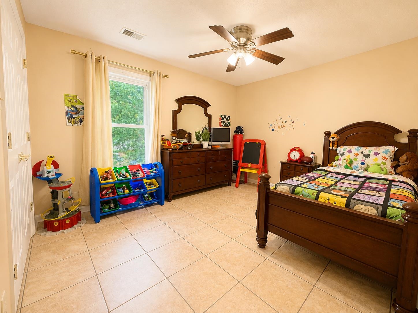 326 South Sanga Road Cordova, TN 38018 - Photo 25 of 32 Spacious room featuring tile flooring, a large window with natural light, a ceiling fan with integrated lighting, and neutral wall tones
