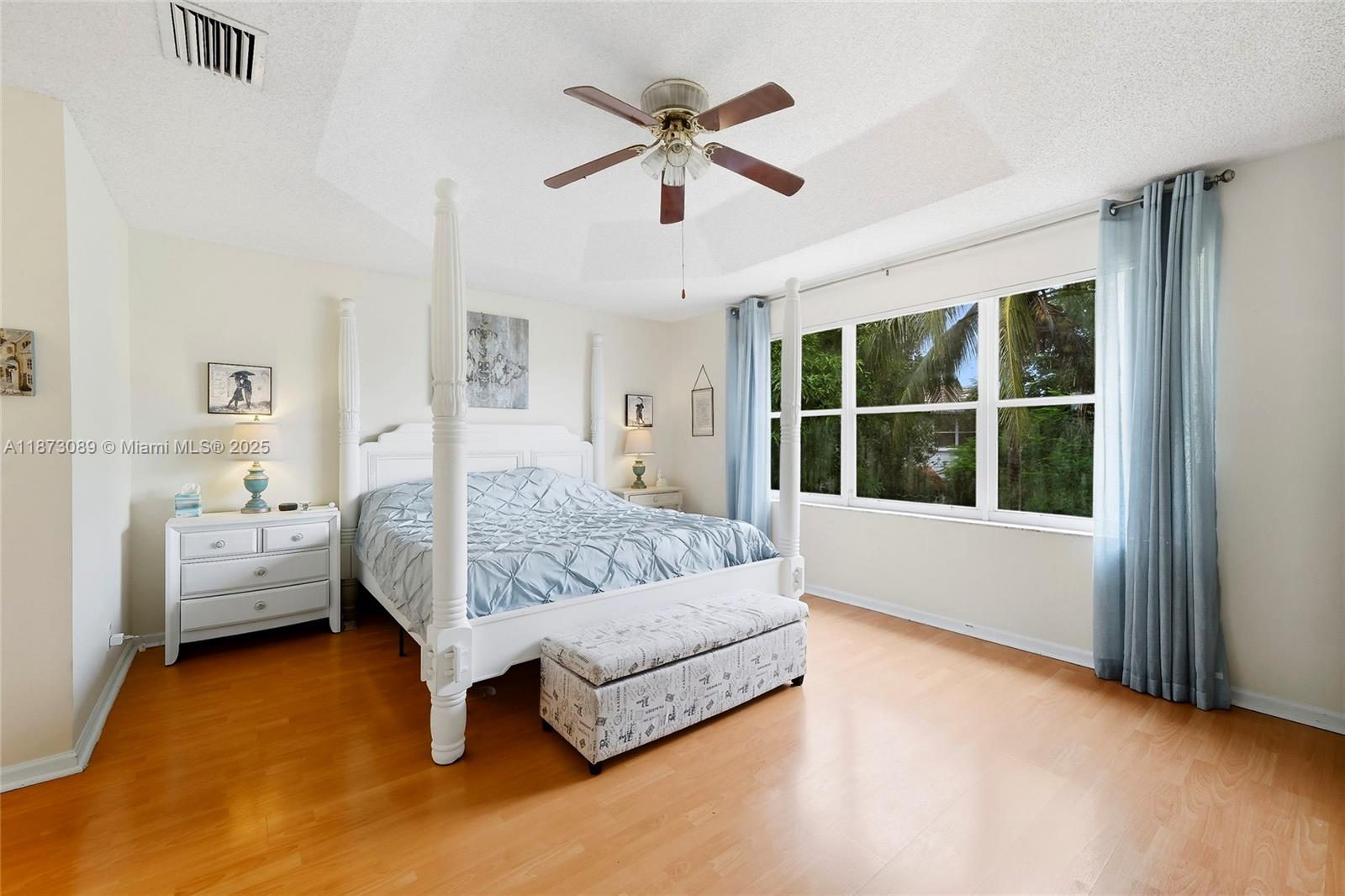15025 Southwest 19th Court Miramar, FL 33027 - Photo 13 of 28 a bed sitting in a spacious bedroom next to a window