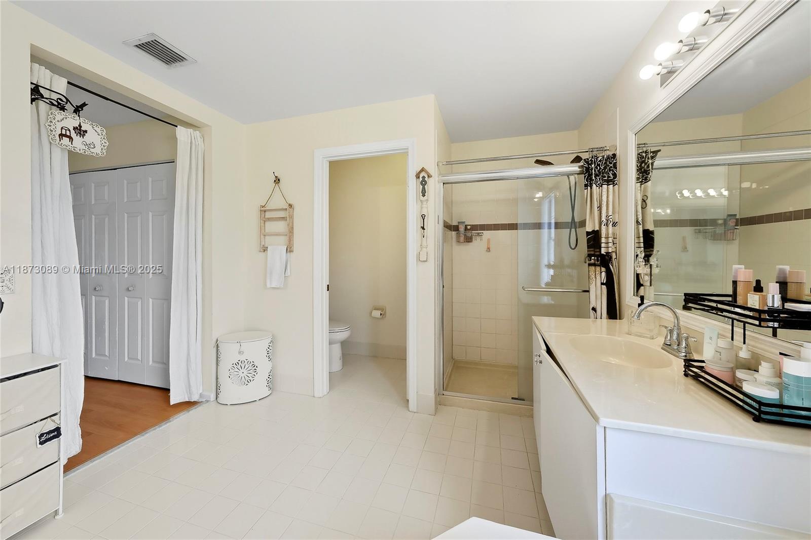 15025 Southwest 19th Court Miramar, FL 33027 - Photo 16 of 28 a bathroom with a sink a toilet and shower