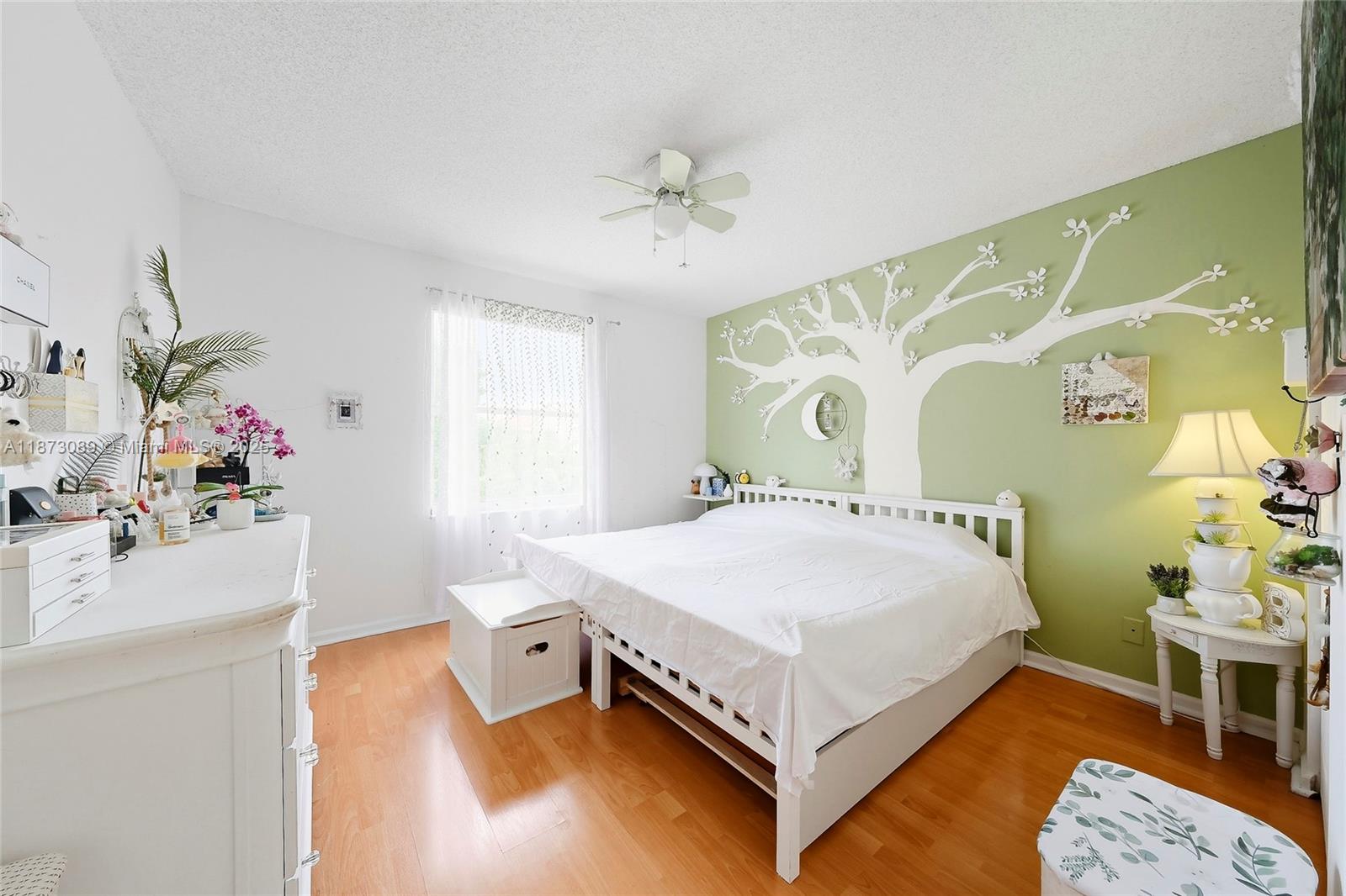 15025 Southwest 19th Court Miramar, FL 33027 - Photo 17 of 28 a white bed sitting in a bedroom next to a window