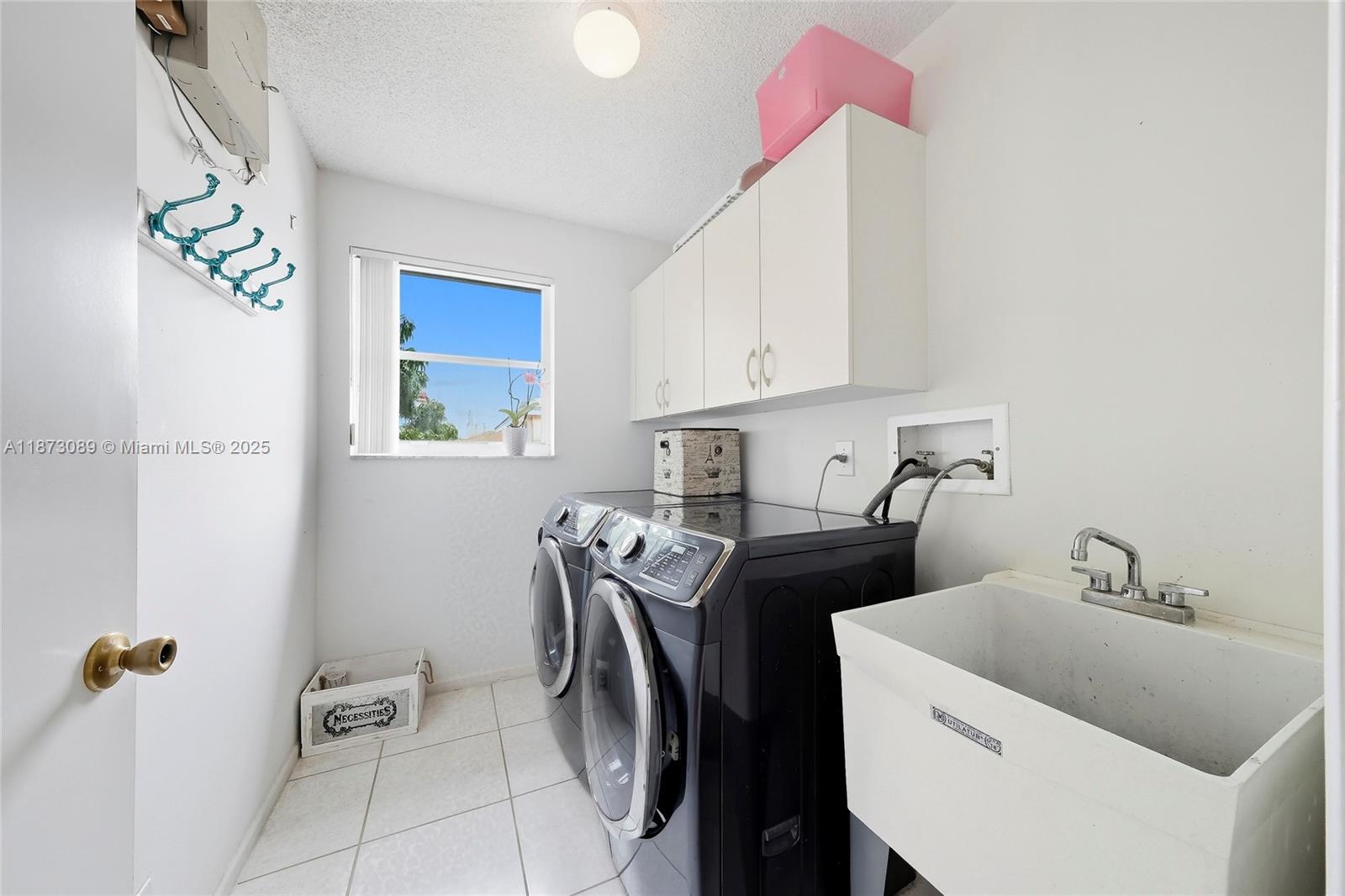 15025 Southwest 19th Court Miramar, FL 33027 - Photo 21 of 28 a utility room with dryer and washer