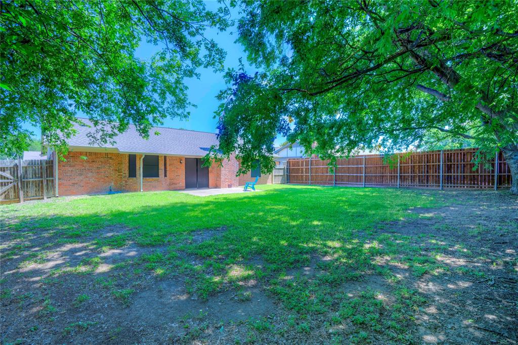 6028 Ridgecrest Drive Watauga, TX 76148 - Photo 36 of 40 a view of a house with a yard