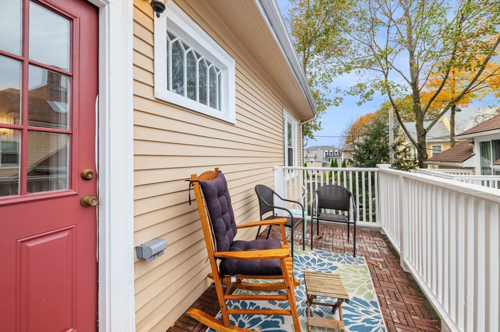 73 Orange Street, Unit 2 Waltham, MA 02453 - Photo 19 of 40 a balcony view with a seating space