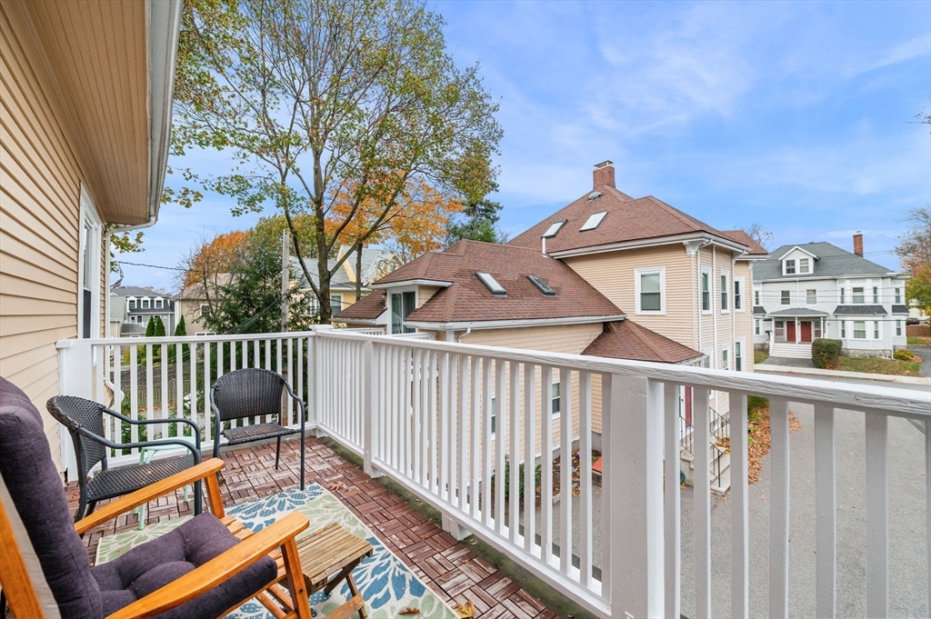 73 Orange Street, Unit 2 Waltham, MA 02453 - Photo 20 of 40 a view of a bench in balcony
