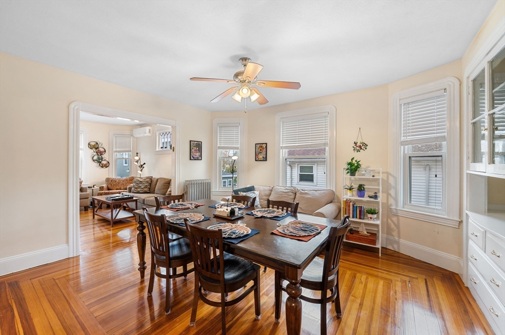73 Orange Street, Unit 2 Waltham, MA 02453 - Photo 5 of 40 a view of a dining room with furniture and wooden floor