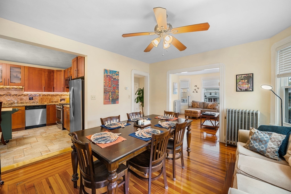 73 Orange Street, Unit 2 Waltham, MA 02453 - Photo 7 of 40 a view of a dining room with furniture and wooden floor