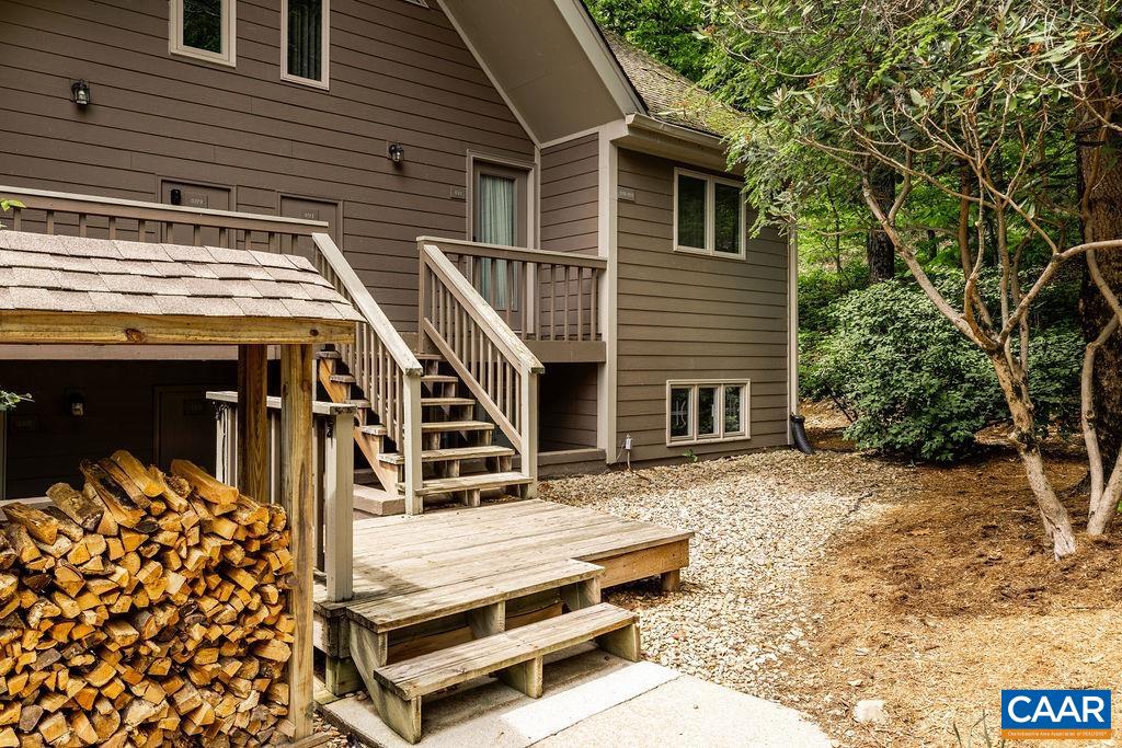 490 3 Ridges Roseland, VA 22967 - Photo 26 of 27 a backyard of a house with wooden fence and large trees