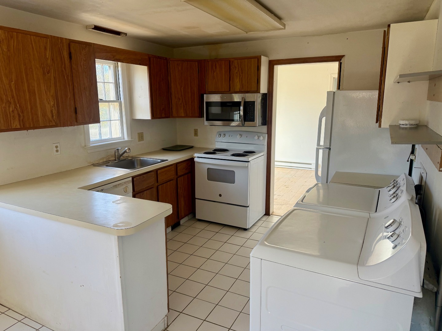 1 Pinkham Circle Nantucket, MA 02554 - Photo 7 of 12 a kitchen with a sink stove and refrigerator