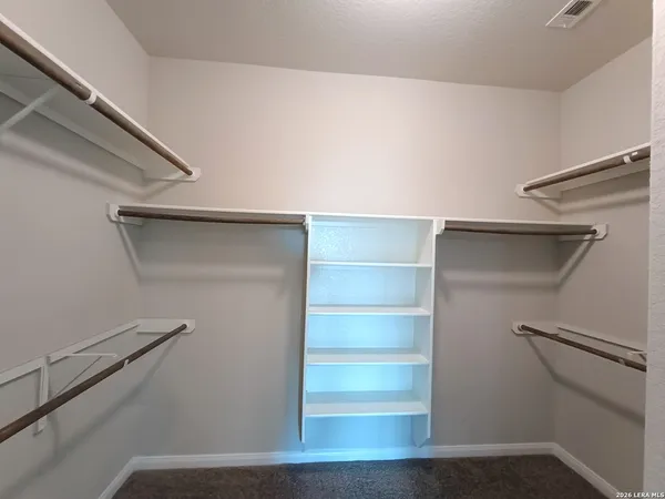 a view of an empty walk in closet
