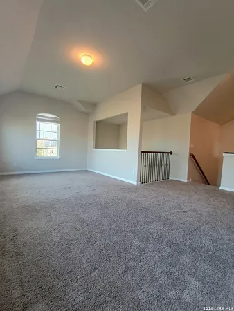 a view of empty room with windows