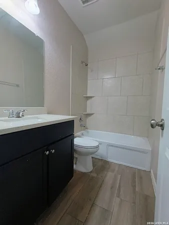 a bathroom with a sink a toilet and a bathtub